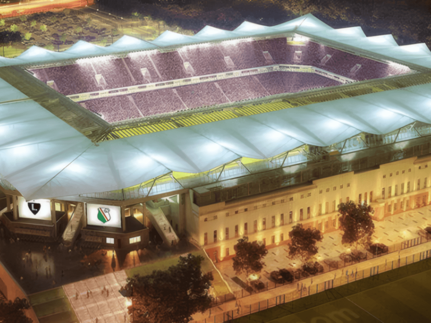Das Stadion von Legia Warschau als innovatives Bauprojekt der Hellmich Gruppe, beleuchtet in einer nächtlichen Aufnahme mit klar sichtbarer Dachkonstruktion und Tribünenstruktur.
